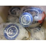 A quantity of "Willow" pattern and associated blue and white wares, including bowls, plates,