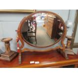 An Edwardian mahogany oval dressing table mirror