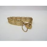 A 9ct gold gate bracelet with padlock clasp