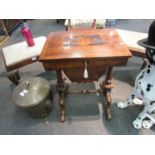 A 19th Century sewing table on carved legs to stretcher base,
