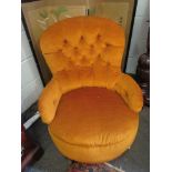 A button back chair on castors in mustard colour upholstery