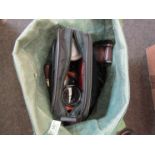 A bag of various camera accessories and binoculars etc.