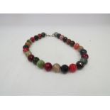 A facet cut bead necklace including agate,