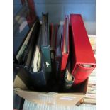 A box of stamp albums and stock books