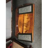 A pair of hammered pewter figural wall hangings and a marquetry inlaid hardwood tray (3)