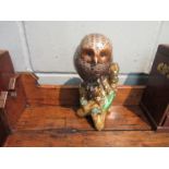 An Oriental glazed pottery figure of an owl on branch,