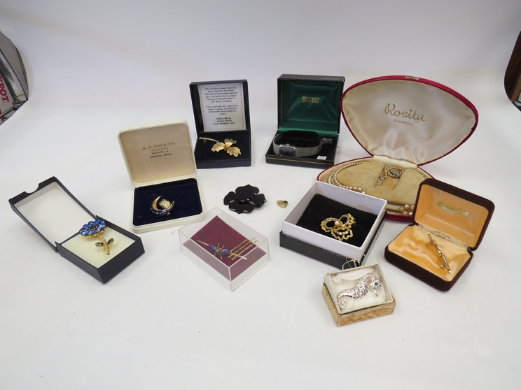 A quantity of costume jewellery including brooches and lady's Rotary watch