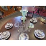 A Victorian silver plated epergne with three lime green vaseline glass flutes and a replacement
