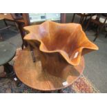 A carved hardwood splash design oversized pot,