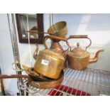 A selection of brass and copper wares including copper jug, pans,