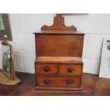 A 19th Century elm wall hanging cabinet, lift up flap and two drawers over single drawer,