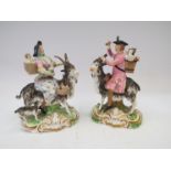 A pair of early 19th Century Derby porcelain figures of lady and gentleman riding goats,