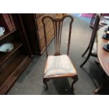 A set of four Chippendale style chairs with oatmeal colour upholstered seats