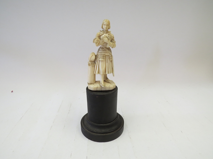 A 19th Century ivory figure of a young knight, 9.