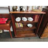 A Victorian mahogany and pine two shelf bookcase with column supports,