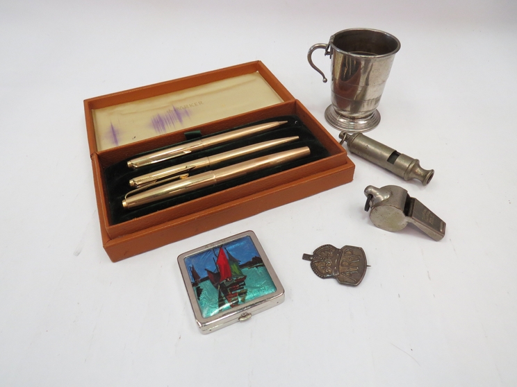 A mixed lot including a Parker pen set, Acme whistles, telescopic cup,
