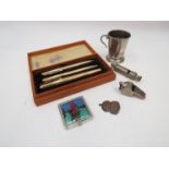 A mixed lot including a Parker pen set, Acme whistles, telescopic cup,