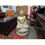 A fibre clay gold effect seated Buddha,