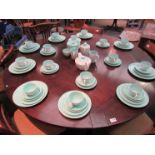 A quantity of Poole pottery turquoise ground tablewares