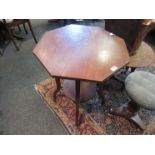 A 1930's walnut octagonal top lamp table with undertier