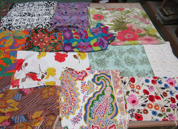 A good number of 1960's and 70's bright floral and psychedelic prints,
