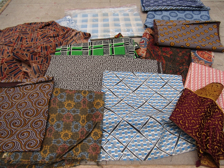 A small quantity of small scale swatches of geometric and African prints for men swear.