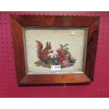A rosewood framed and glazed tapestry of a squirrel,