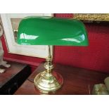 A green glass and brass bankers lamp