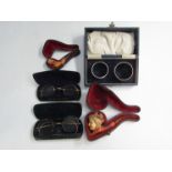 Two pairs of pince-nez spectacles,