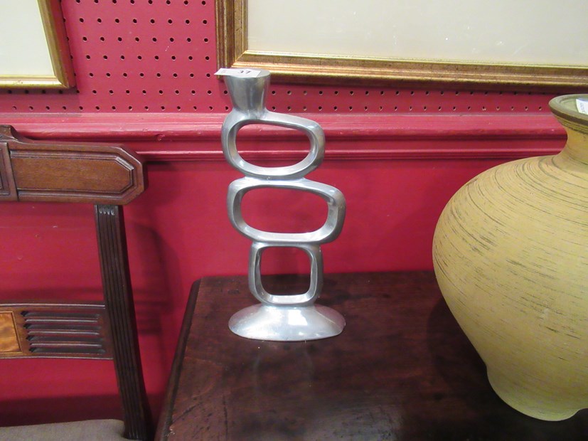 A pair of modernistic candlesticks,