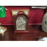A mahogany cased Westminster chime mantel clock with key and pendulum,
