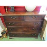 Circa 1800 a flame mahogany chest of two short over three long drawers with brass swan neck handles,