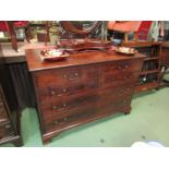 An early George III flame mahogany chest of two short over three graduating long drawers with oak