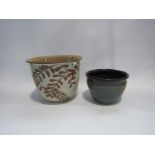 Two studio pottery planters, one green glazed,