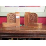 A pair of wooden bookends with carved floral detail, 17.