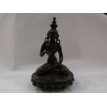 An Eastern bronze seated deity,