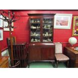 A George V mahogany bookcase on base,