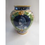 A Faience ovoid vase, with yellow, blue and green decoration,