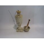 An alabaster table lamp base and pestle and mortar