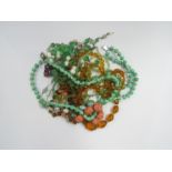 Various bead necklaces including green glass