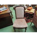 A pair of French Victorian carved walnut and ebonised chairs with turned and chamfered legs on