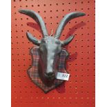 A pair of mounted goat heads,