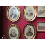 Four oval gilt framed portraits of males and females,