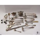 A quantity of silver items including spoons, mustard,