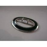 A silver and enamelled oval buckle,
