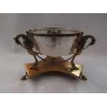 A gilt metal bon-bon dish griffin supports holding a frosted and clear glass bowl