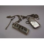 A silver ingot on chain and another