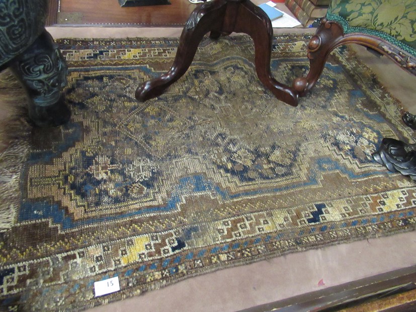 An Eastern blue and brown ground rug, heavily worn, - Image 2 of 2