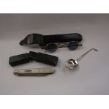 A pair of cased silver folding spectacles, silver spoon with golf club knop,