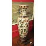 A large Oriental vase depicting birds in foliage on wooden base, marked made in china,